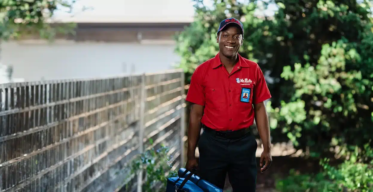 A Mr. Rooter professional greeting customers