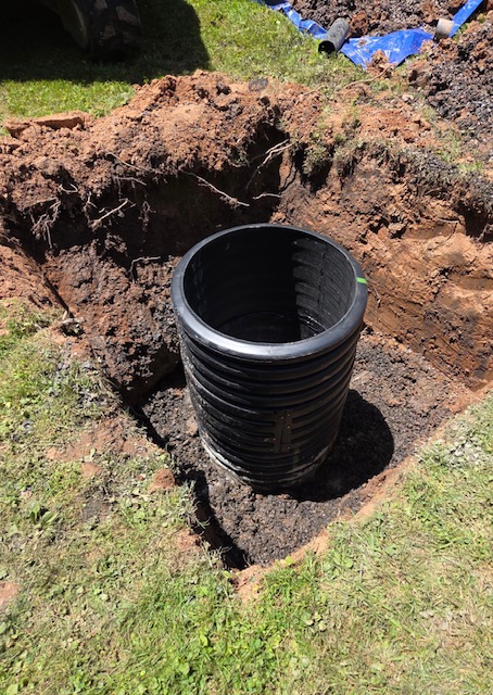 black plastic tube outside for a distribution box